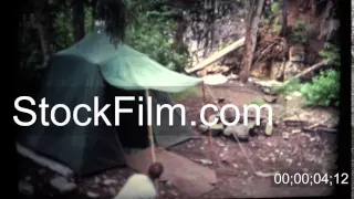 1960 Man Setting Up a Old Camping Tent