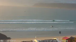 Lucky surfer paddles solo this morning at Muizenberg Beach. Captured on our live stream webcam