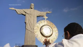 Christ the Redeemer decorated with a colorful carpet to celebrate the Catholic holiday of Corpus Chr