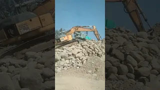 OLD KOMATSU PC228us climbing in the boulders stockpile #short