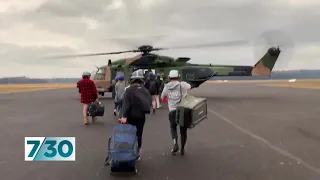 More than 300 people evacuated by air from Mallacoota | 7.30