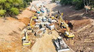 Great action Dump truck unloading rock soil building foundation Canal dozer pushing, excavator digg