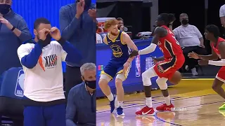 Steph Curry imitating Nico Mannion's behind-the-back dime from the bench