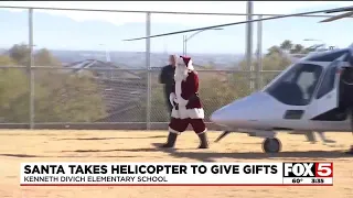 Santa takes helicopter to give gifts in Las Vegas Valley