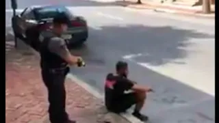 Video shows officer using stun gun on man sitting on sidewalk