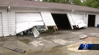 Rain causing flash flooding takes over apartment complex, destroying belongings and vehicles