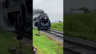 Steam Locomotive Norfolk and Western 611 passing the Red Caboose Motel in Strasburg.