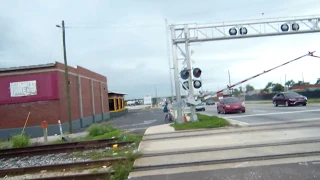 Amtrak train and cyclist ignoring crossing signals.