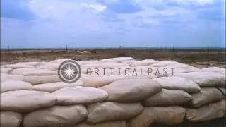 Military installations, vehicles and an M107 Self Propelled 175mm gun in Bien Hoa...HD Stock Footage