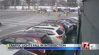 Caught on video: Traffic lights fall across intersection