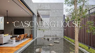 Discover the Seamless Blend of Concrete and Wood in Cascading House