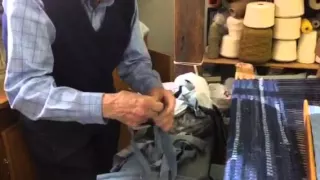 Carl Bretz explains the process of turning old blue jeans into woven rugs