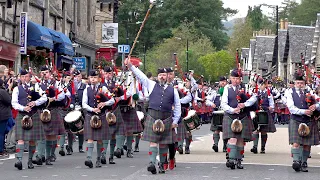 2019 Street Parade of 11 Pipe Bands marching through Pitlochry town centre in Perthshire, Scotland