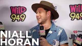 Niall Horan talks with JV and Selena backstage at The WiLD 94.9 Jingle Ball 2017