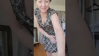 Mature woman prepares for swimsuit try on