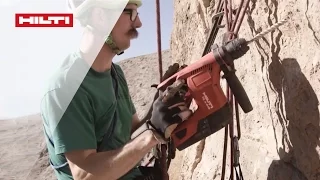 Setting rock climbing routes is a challenging job - reach for the Hilti