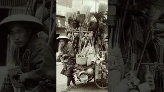 This photograph shows a man selling brooms and baskets in Japan in the 1890s. #shorts