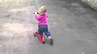 Child 1 year 10 months riding a scooter