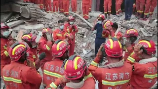 Firefighters Pay Respects to Victims of Deadly Hotel Building Collapse in Suzhou