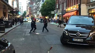 Street fight and police in Central London.