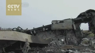 Plane wreckage leaves eastern Ukraine