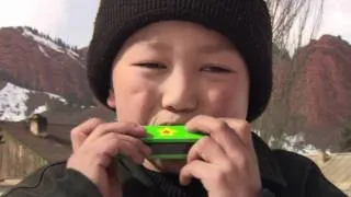 Operation Christmas Child - Boy Plays Harmonica