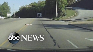 Young child falls out of the back of a church bus onto the highway