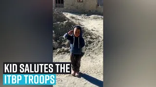 Kid salutes the ITBP troops passing by in Chushul Village of Ladakh.