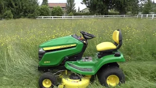 John Deere X350 mowing grass 4-5 feet tall, yes it can do it!