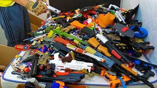 Hundreds of Toy Guns On The Bed