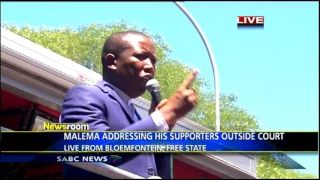 Malema addressing his supporters outside Bloem court