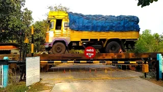 RORO Truck train through a Rural Railroad Level Crossing :: Indian Railways