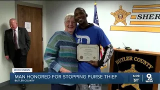 Good Samaritan honored after stopping purse thief