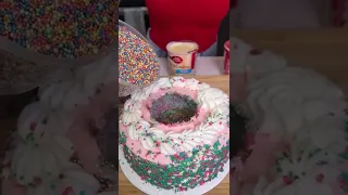 The cakes explodes with sprinkles when she cuts it #shorts