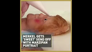 Merkel gets 'sweet' send off marzipan portrait #shorts