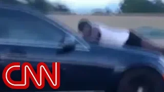 Man clings to car hood going 70mph