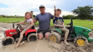 Playing in the mud and pulling real tractor out of the mud | Tractors for kids