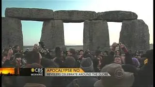 Crowds gather to watch sunrise at Stonehenge