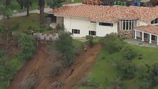 Mudslides on Mulholland Drive close road, damage homes