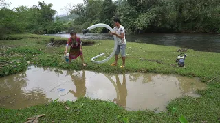 Wild Fishing Exciting, Unique Catch Big Catfish With A Large Pump Sucks Water Out Of Wild Mud Lake