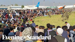 Chaos at Kabul airport as desperate crowds try to flee Afghanistan