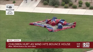 Four children hospitalized after bounce house is picked up by wind in Mesa