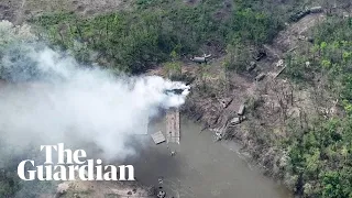 Ukraine: drone footage shows destroyed bridge and vehicles at Donbas river crossing