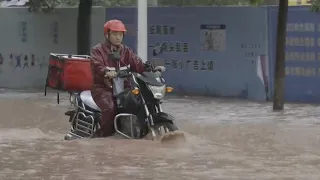 Floods hit cities, villages across China after torrential rains
