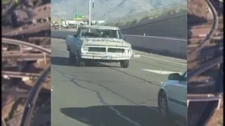 Video captures pickup truck driver driving in reverse on Interstate