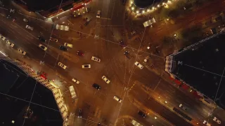 AERIAL: Birds View of big intersection traffic at night in Berlin, Germany rosenthaler platz street