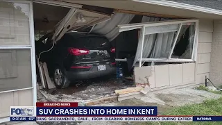 SUV crashes into home in Kent