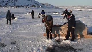 Ice fishing Up River Kangirsuk Nunavik