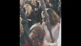 Daisy Ridley greeting and signing memorabilia at the L.A. premiere of Ep.7. (2015)