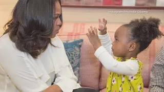 Little girl fascinated by Michelle Obama’s portrait meets former first lady